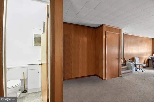 a bedroom with bed and a window