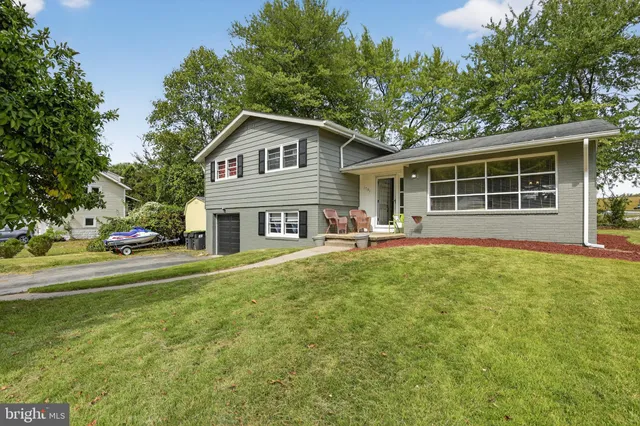 a front view of a house with a garden and porch