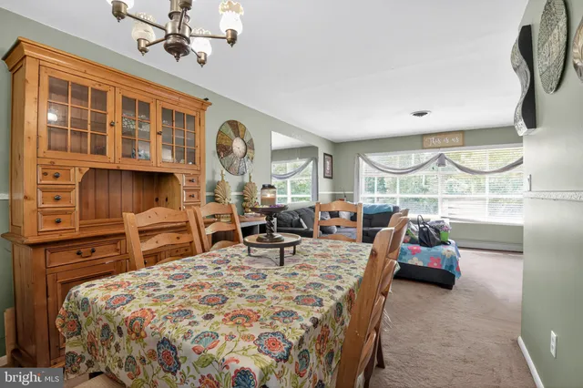 a kitchen with stainless steel appliances granite countertop a stove top oven a sink a counter space and cabinets