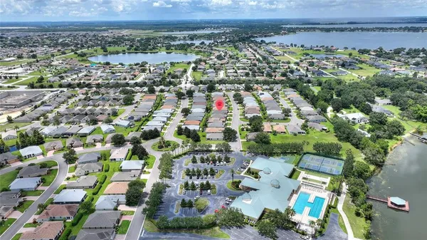 an aerial view of residential building and trees around