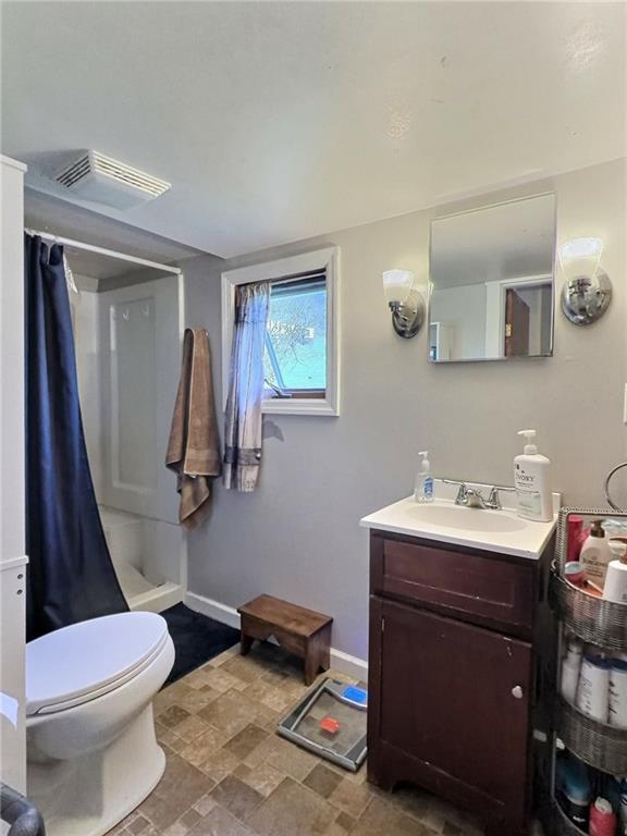 23 Main Street Taylorstown, PA 15365 - Photo 20 of 22 a bathroom with a sink a toilet and mirror