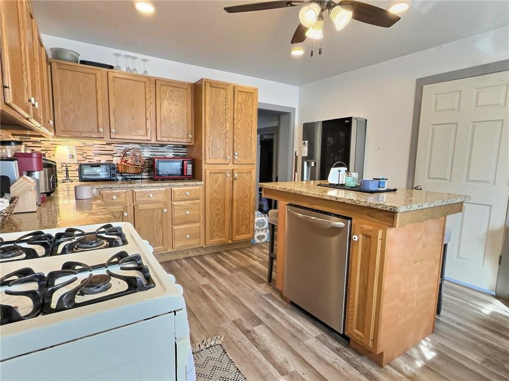 23 Main Street Taylorstown, PA 15365 - Photo 7 of 22 a kitchen with a stove and a refrigerator