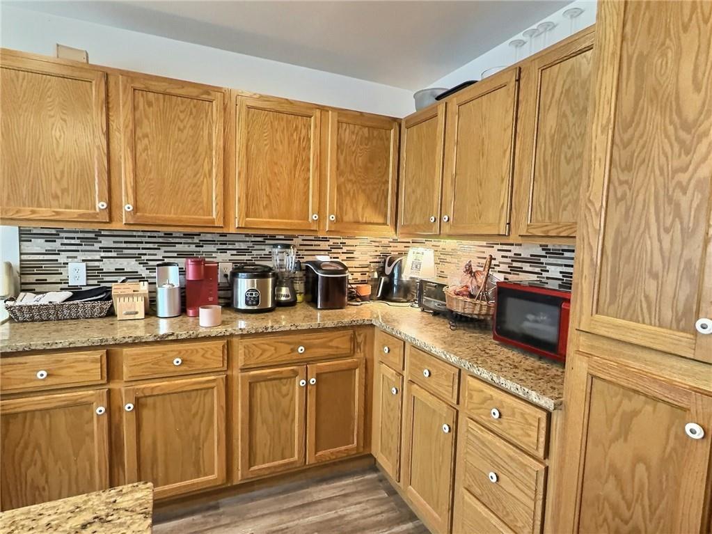 23 Main Street Taylorstown, PA 15365 - Photo 10 of 22 a kitchen with stainless steel appliances granite countertop a stove a sink and white cabinets