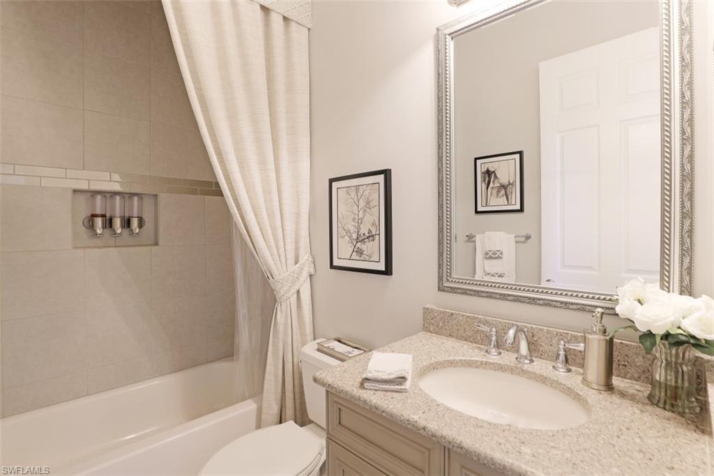 2832 Cinnamon Bay Circle Naples, FL 34119 - Photo 21 of 35 a bathroom with a granite countertop sink toilet and shower
