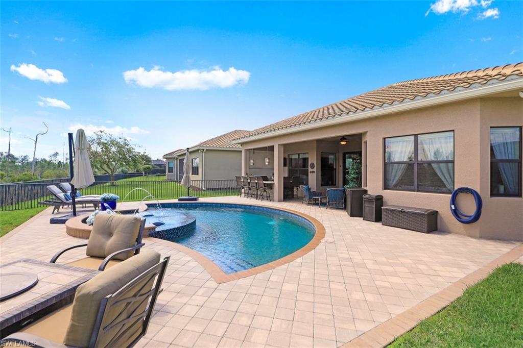 2832 Cinnamon Bay Circle Naples, FL 34119 - Photo 26 of 35 a view of outdoor space yard swimming pool and patio