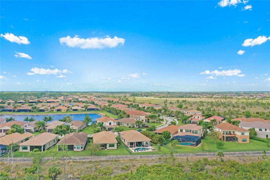 2832 Cinnamon Bay Circle Naples, FL 34119 - Photo 33 of 35 an aerial view of residential houses with outdoor space