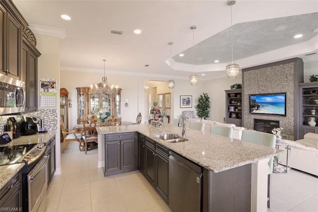 2832 Cinnamon Bay Circle Naples, FL 34119 - Photo 10 of 35 a kitchen with lots of counter top space