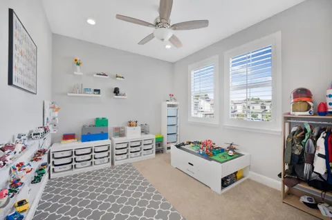 a bed room with furniture and a window