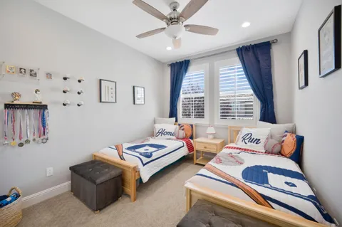 a bedroom with furniture and a window