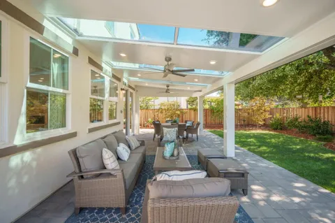 a outdoor space with patio the couches and a dining table with garden view