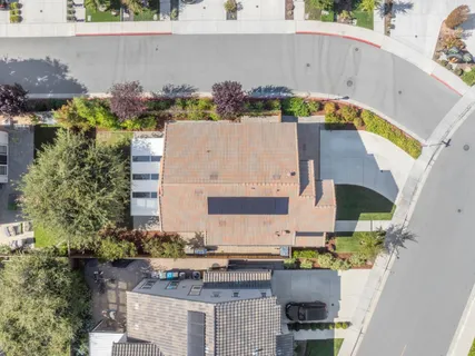 a view of a patio with table and chairs and potted plants