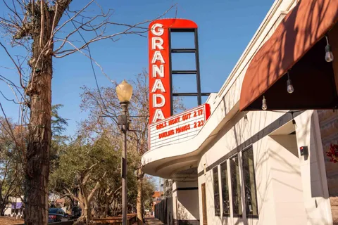 a view of a street with cars