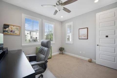 a livingroom with window and a couch