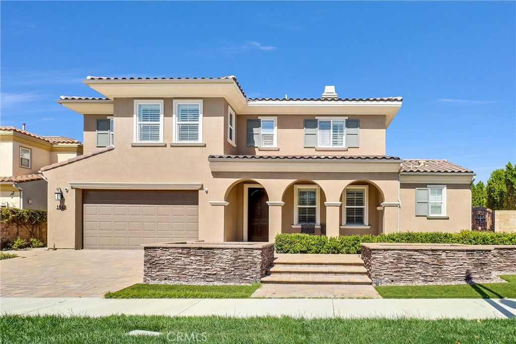 1049 Newhall Terrace Brea, CA 92821 - Photo 1 of 1 a front view of a house with a yard