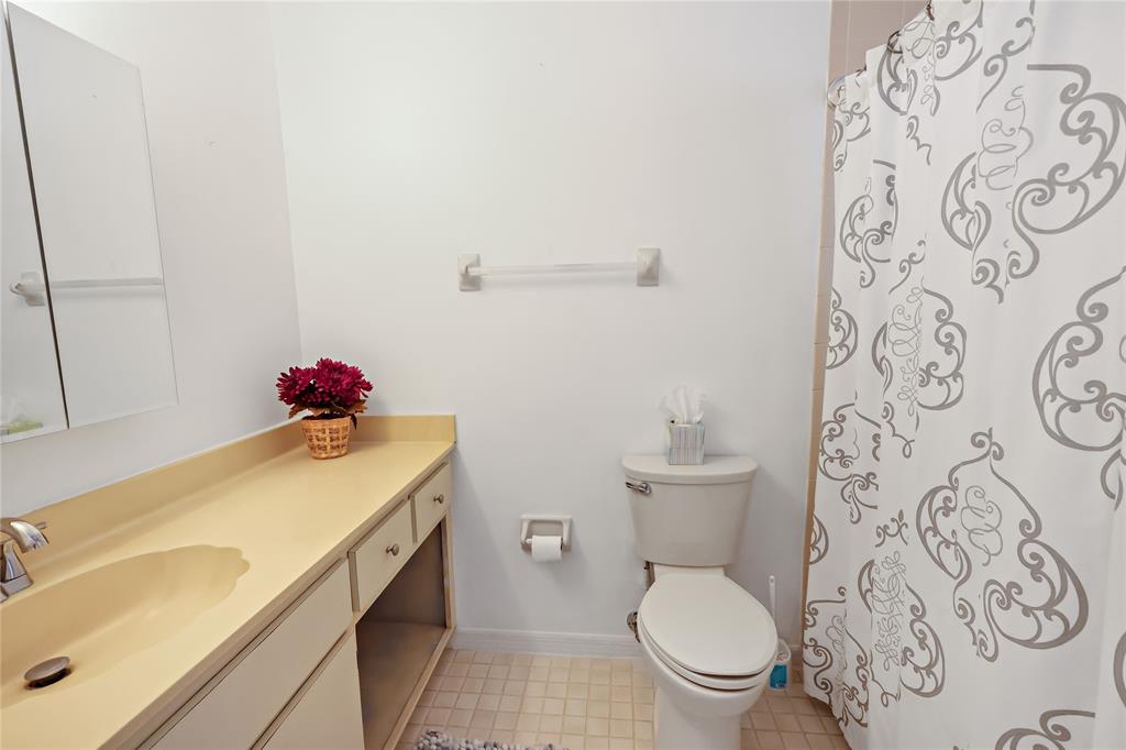 8520 Highway 1, Unit G3 Micco, FL 32976 - Photo 9 of 12 a bathroom with a sink and a toilet