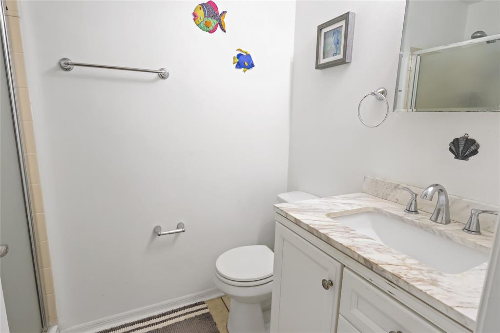 8520 Highway 1, Unit G3 Micco, FL 32976 - Photo 10 of 12 a bathroom with a granite countertop sink toilet and a mirror
