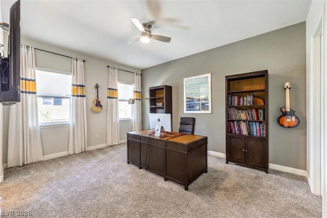 7119 Arabian Ridge Street Las Vegas, NV 89131 - Photo 40 of 73 An airy office space provides ample natural light and a dedicated work area.