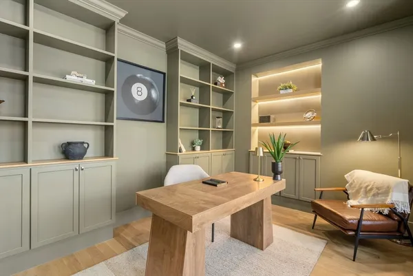 a kitchen with kitchen island granite countertop a sink a center island and stainless steel appliances