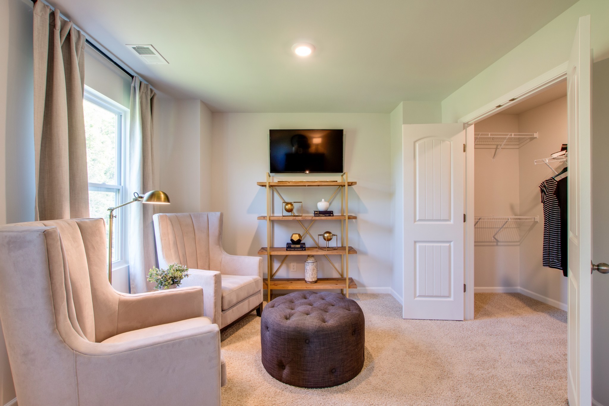 411 Waterfowl Way, Unit 119 Lebanon, TN 37090 - Photo 24 of 32 a living room with furniture and a flat screen tv