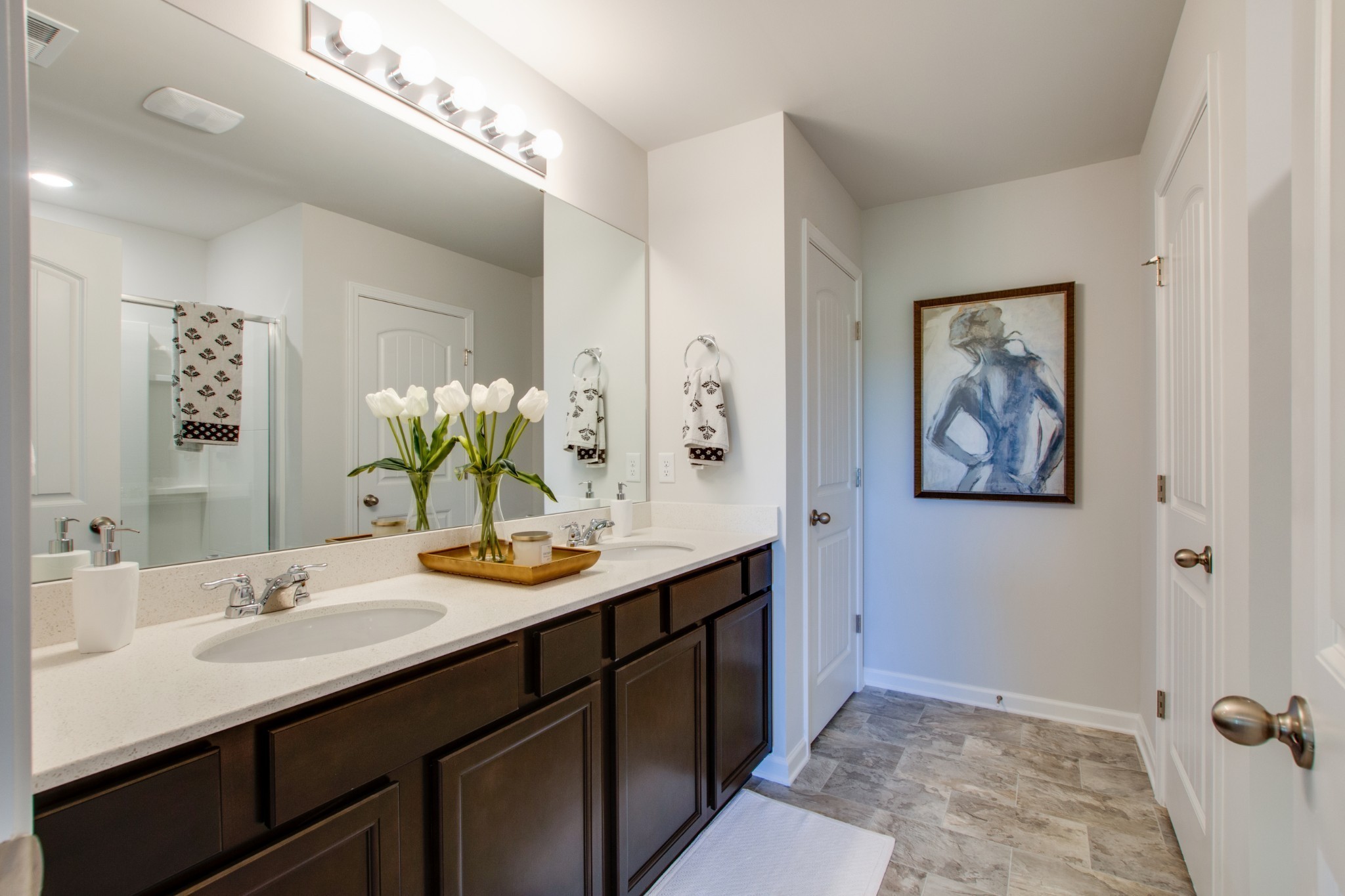 411 Waterfowl Way, Unit 119 Lebanon, TN 37090 - Photo 26 of 32 a bathroom with a sink double vanity granite and a mirror