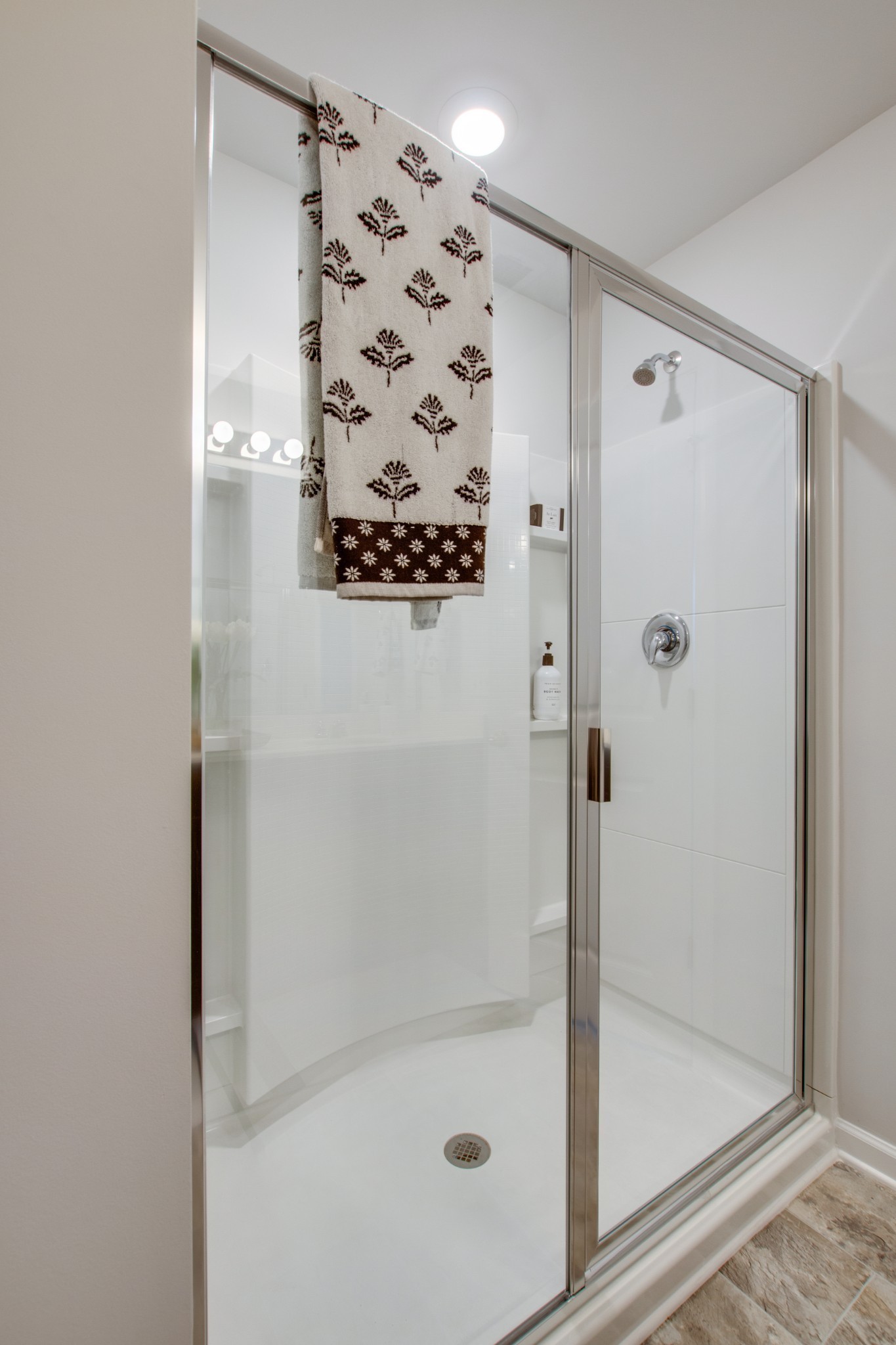 411 Waterfowl Way, Unit 119 Lebanon, TN 37090 - Photo 27 of 32 a bathroom with a glass shower door