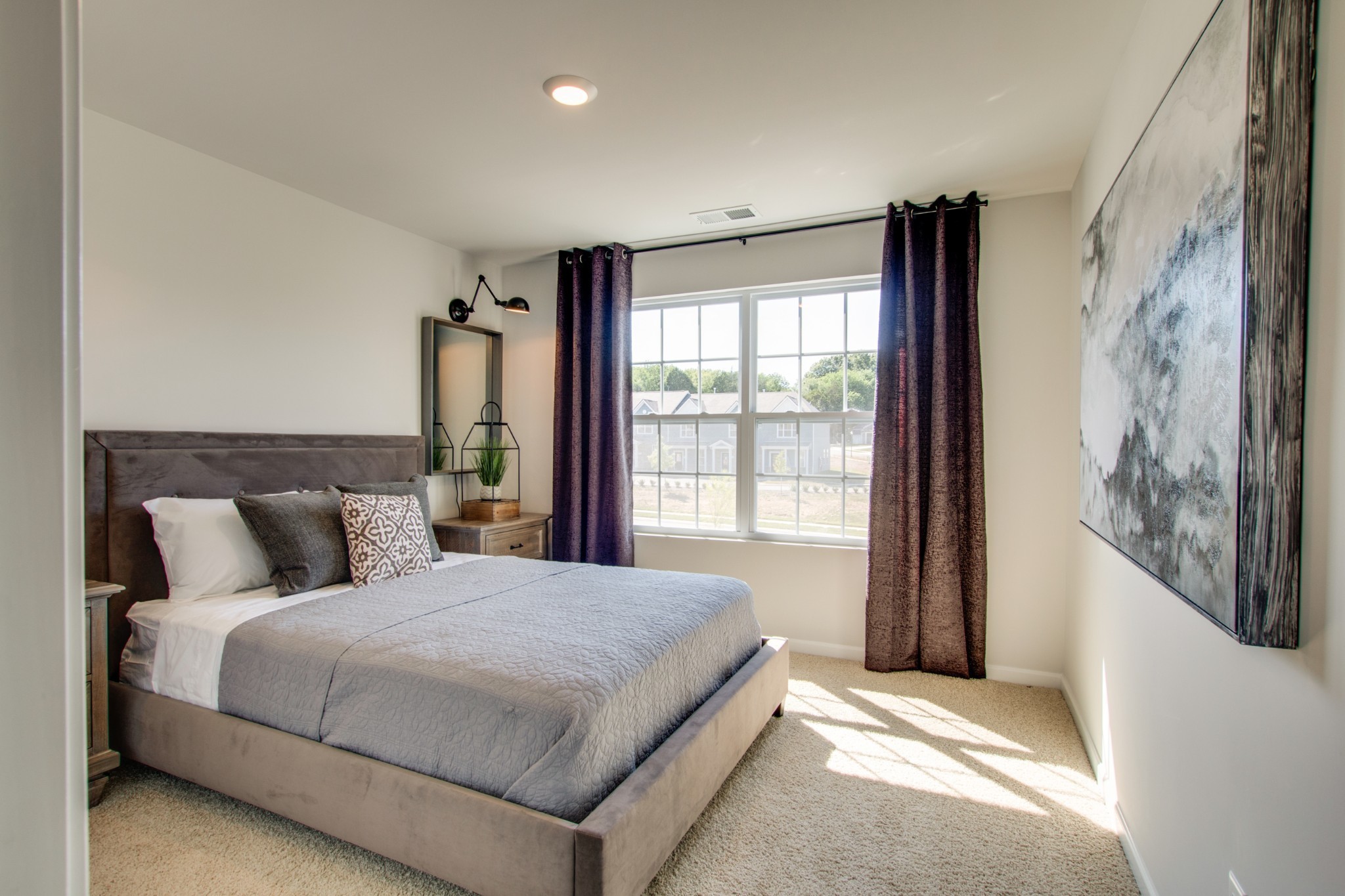 411 Waterfowl Way, Unit 119 Lebanon, TN 37090 - Photo 28 of 32 a bedroom with a large bed and a window