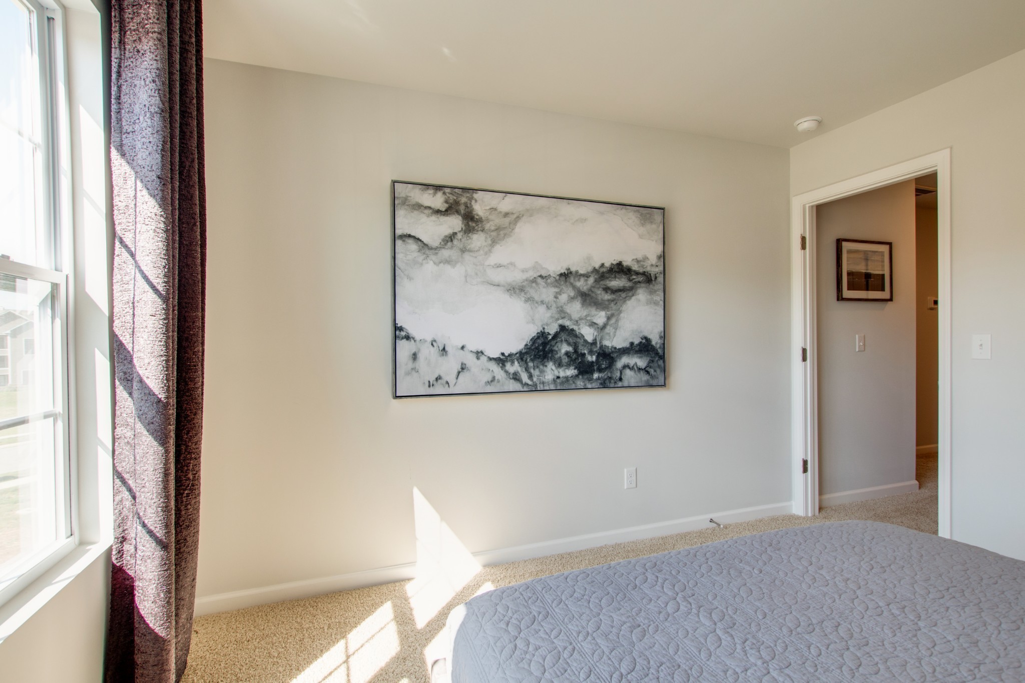 411 Waterfowl Way, Unit 119 Lebanon, TN 37090 - Photo 29 of 32 a bedroom with a bed and a painting on the wall
