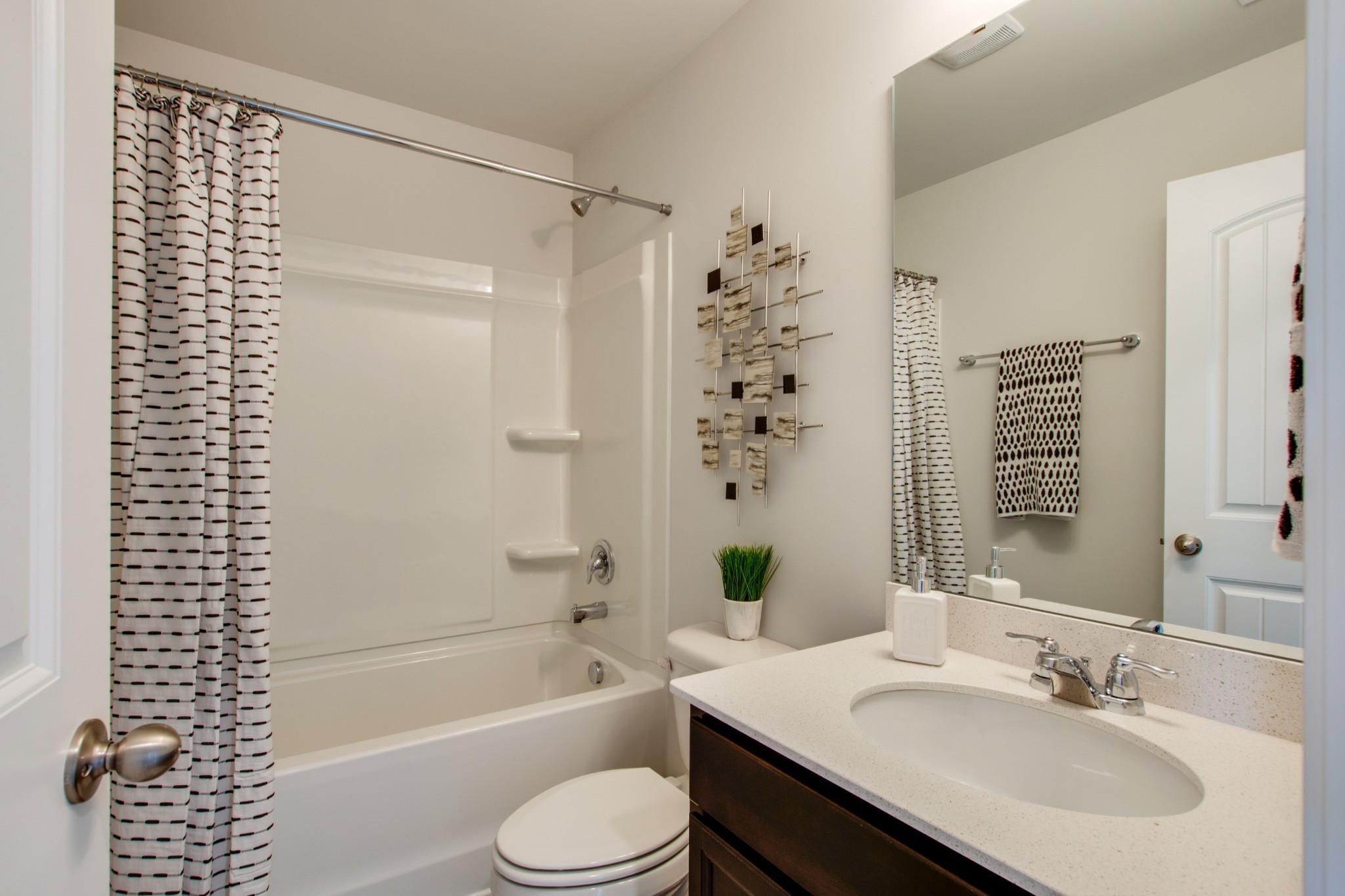 411 Waterfowl Way, Unit 119 Lebanon, TN 37090 - Photo 30 of 32 a bathroom with a sink a toilet and shower