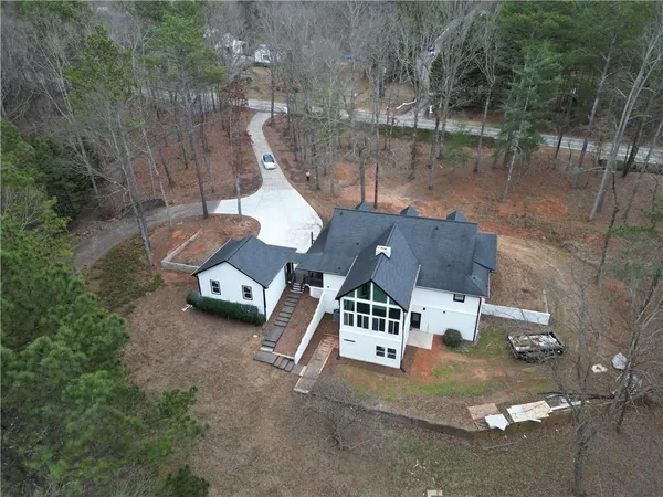 an aerial view of a house with outdoor space
