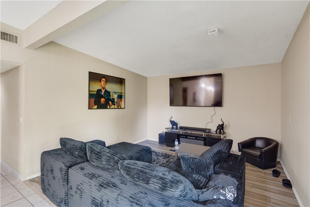 422 Del Monte Road Sebastian, FL 32958 - Photo 11 of 35 a living room with furniture and a flat screen tv