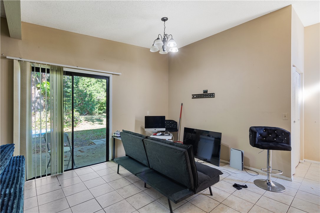 422 Del Monte Road Sebastian, FL 32958 - Photo 13 of 35 a living room with furniture and a window
