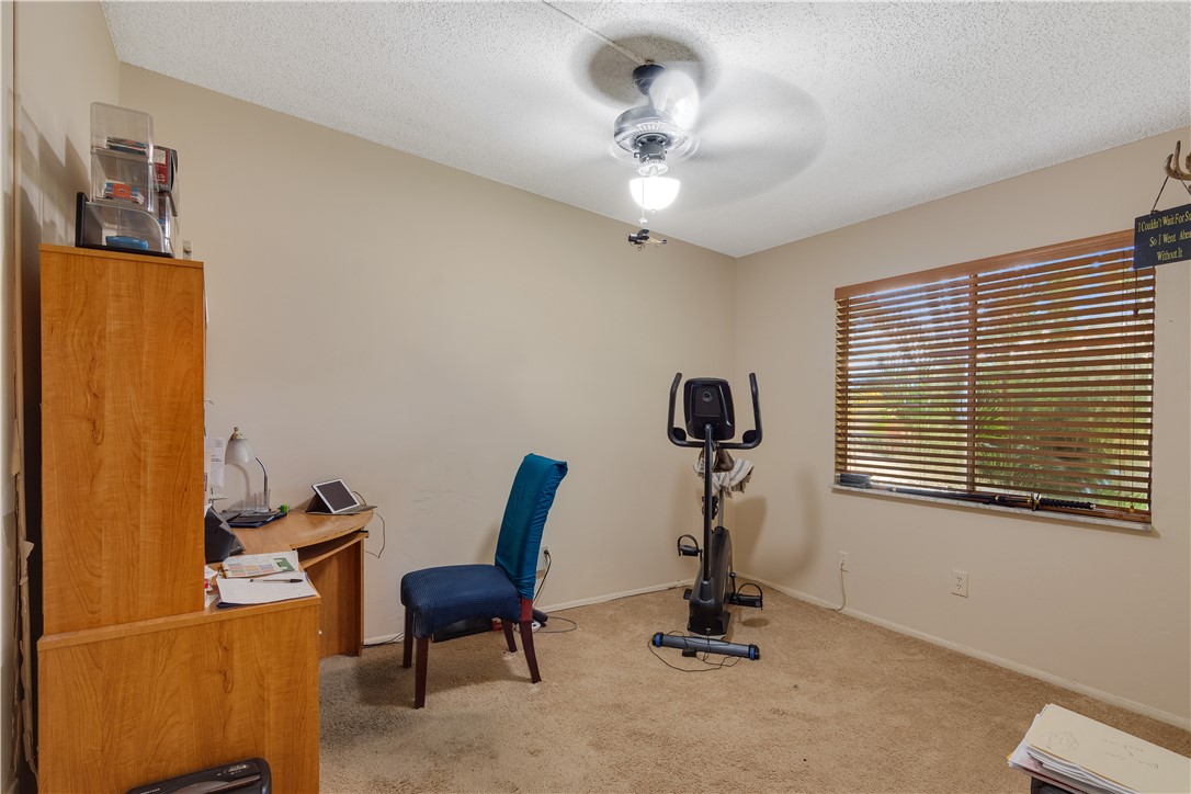 422 Del Monte Road Sebastian, FL 32958 - Photo 30 of 35 a view of a workspace with furniture and a window