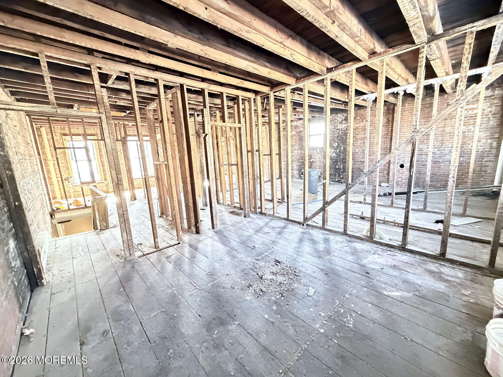 Broad Street Keyport, NJ 07735 - Photo 6 of 9 a view of an empty room with wooden floor and a window