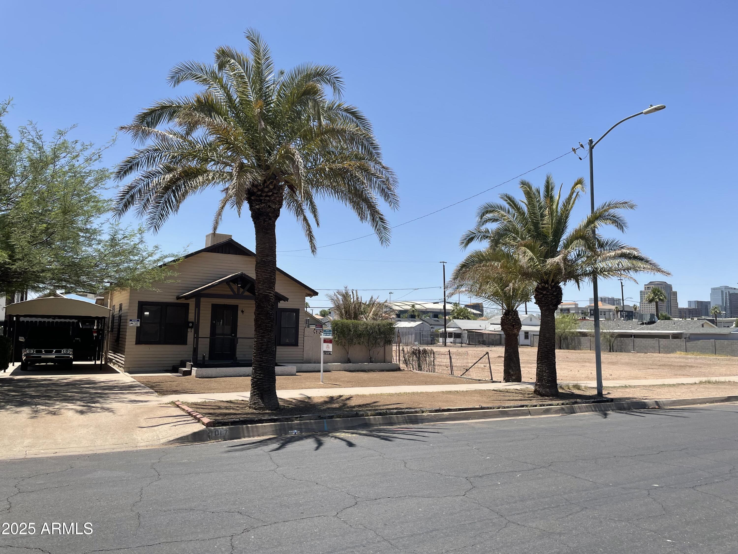 1017 East Taylor Street Phoenix, AZ 85006 - Photo 2 of 45 a front view of multiple houses with yard