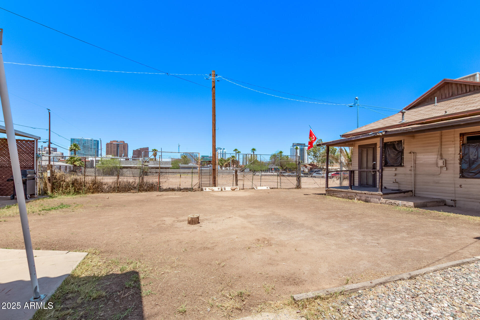 1017 East Taylor Street Phoenix, AZ 85006 - Photo 40 of 45 a view of a terrace with wooden fence