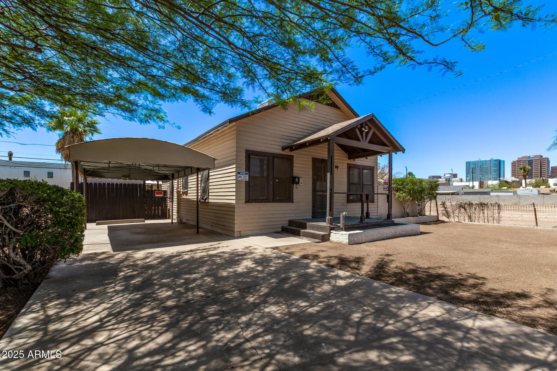 1017 East Taylor Street Phoenix, AZ 85006 - Photo 6 of 45 a front view of a house with a yard