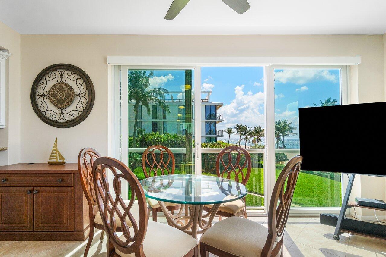 120 Inlet Way, Unit 204 Palm Beach Shores, FL 33404 - Photo 11 of 27 a view of a dining room with furniture window and outside view