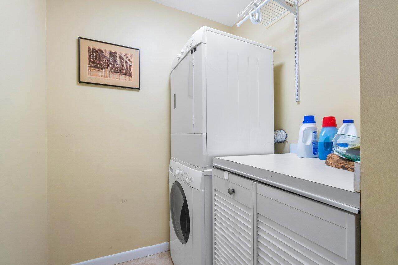 120 Inlet Way, Unit 204 Palm Beach Shores, FL 33404 - Photo 16 of 27 a view of a storage and utility room with a washer dryer
