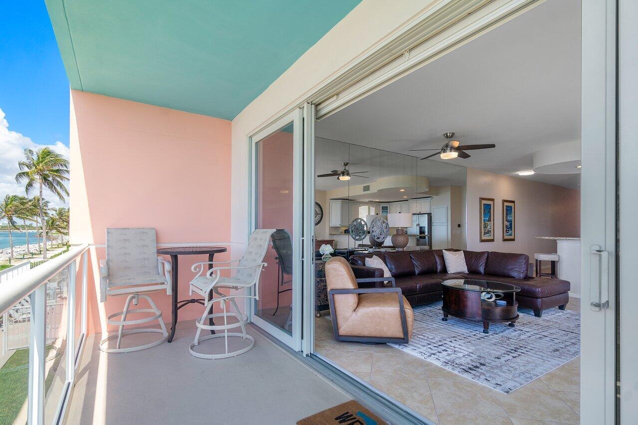 120 Inlet Way, Unit 204 Palm Beach Shores, FL 33404 - Photo 24 of 27 a living room with furniture and a table