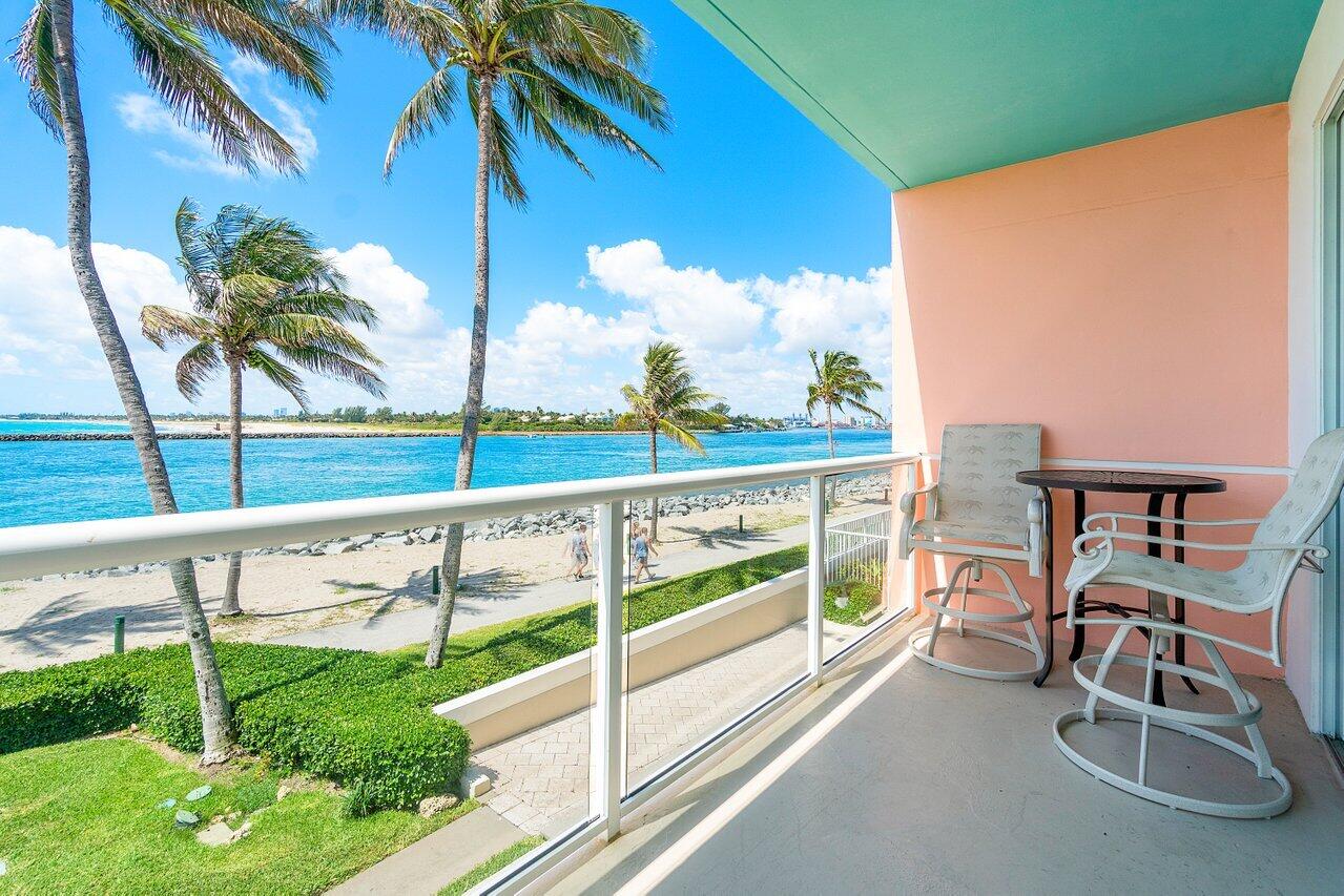 120 Inlet Way, Unit 204 Palm Beach Shores, FL 33404 - Photo 25 of 27 a view of a balcony with chairs