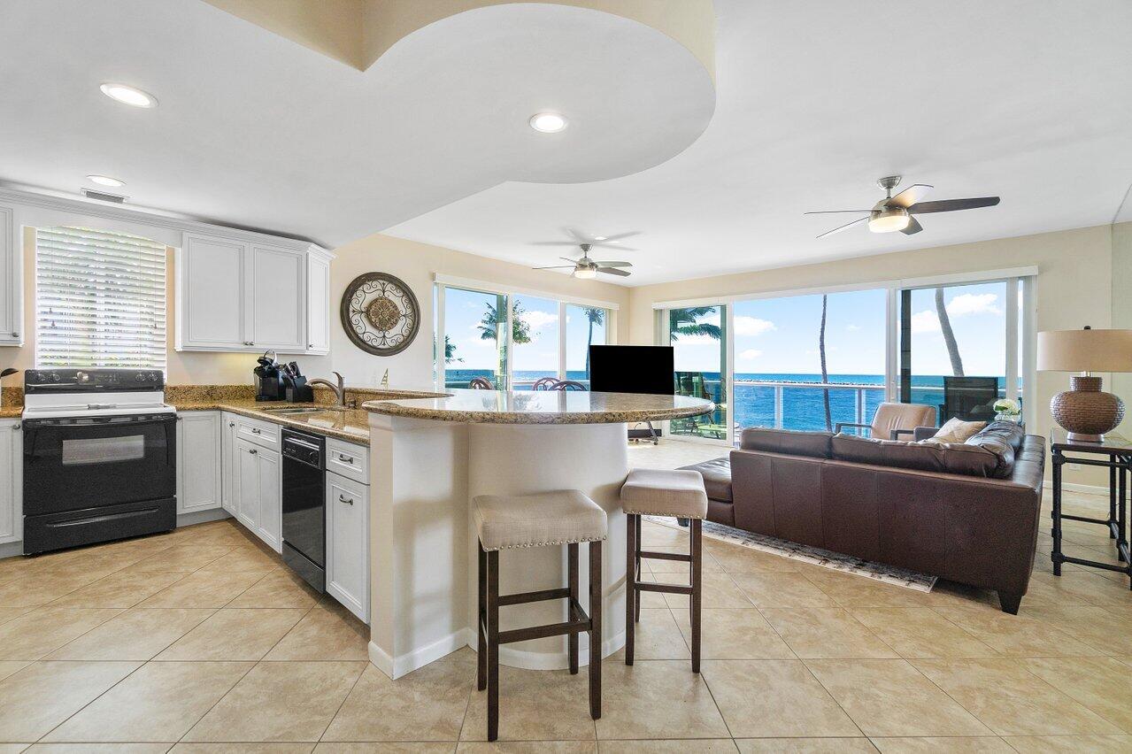 120 Inlet Way, Unit 204 Palm Beach Shores, FL 33404 - Photo 6 of 27 a kitchen with a sink and a stove top oven