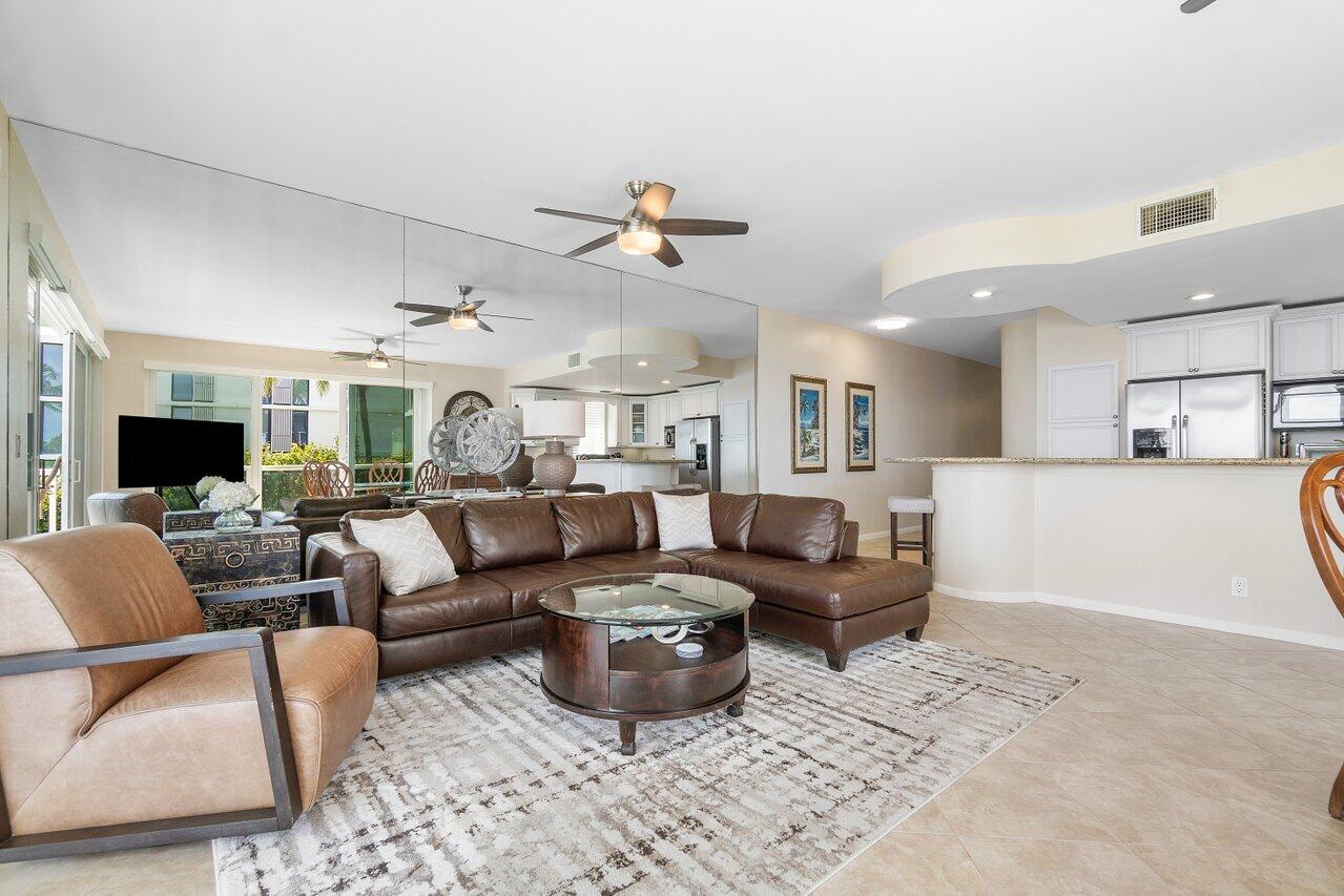 120 Inlet Way, Unit 204 Palm Beach Shores, FL 33404 - Photo 9 of 27 a living room with furniture and a flat screen tv