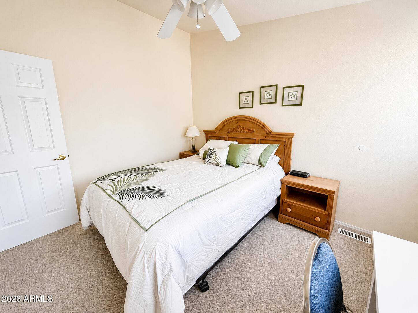 8865 East Baseline Road, Unit 103 Mesa, AZ 85209 - Photo 23 of 47 a bedroom with a bed and a window