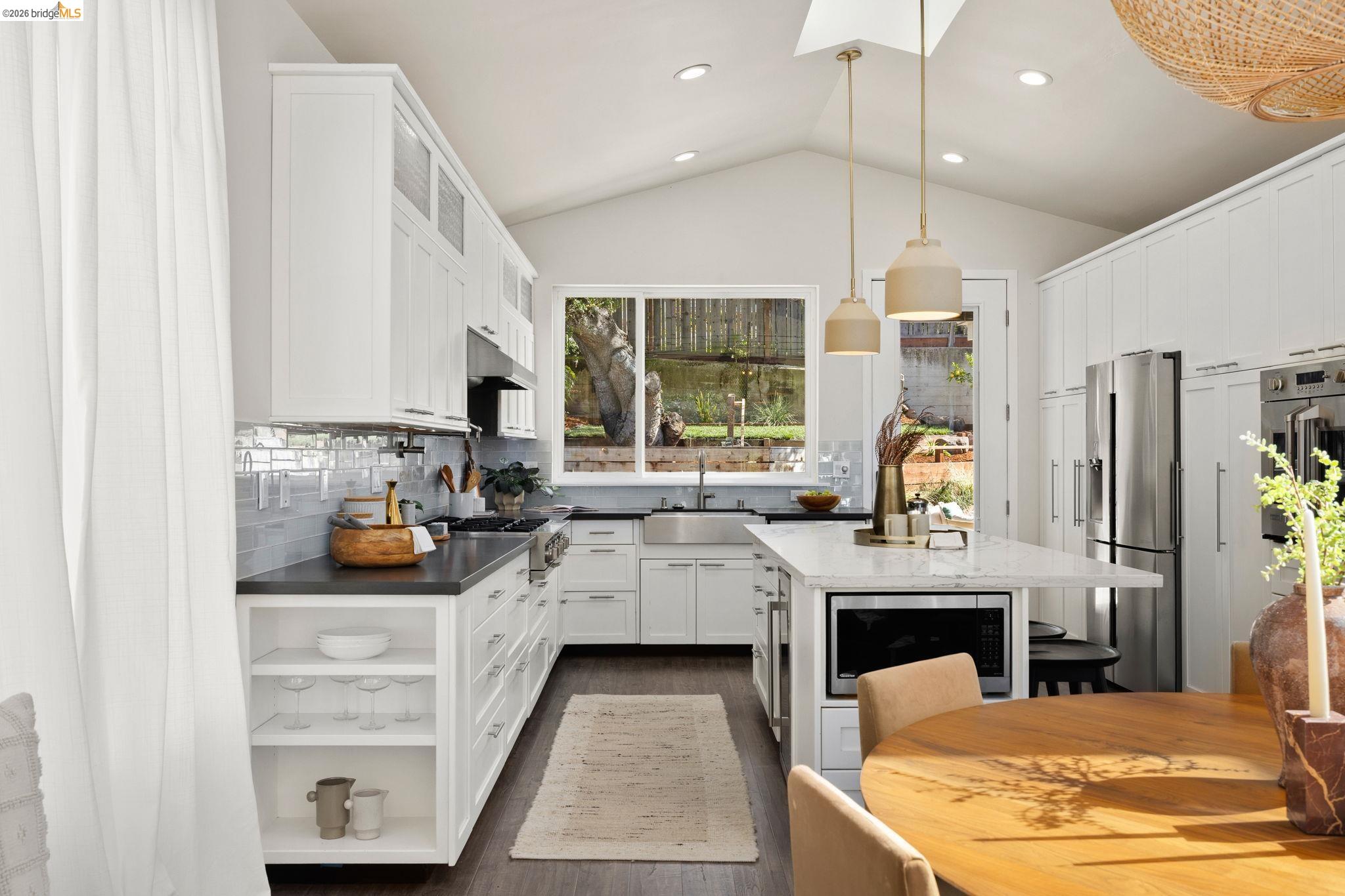1471 Scenic Avenue Berkeley, CA 94708 - Photo 12 of 42 a kitchen with stainless steel appliances granite countertop a stove oven and a refrigerator with cabinets