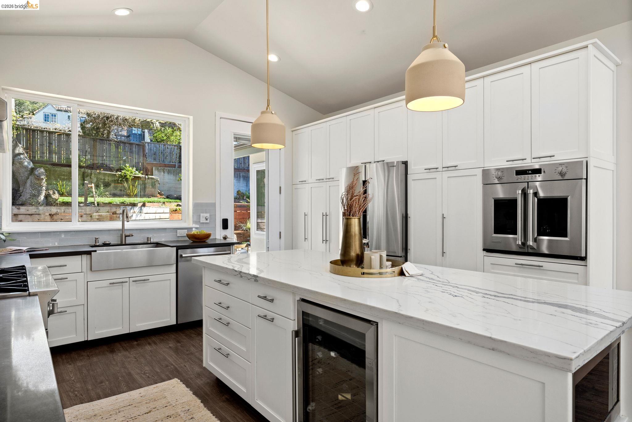 1471 Scenic Avenue Berkeley, CA 94708 - Photo 14 of 42 a kitchen with stainless steel appliances kitchen island granite countertop a sink and a stove