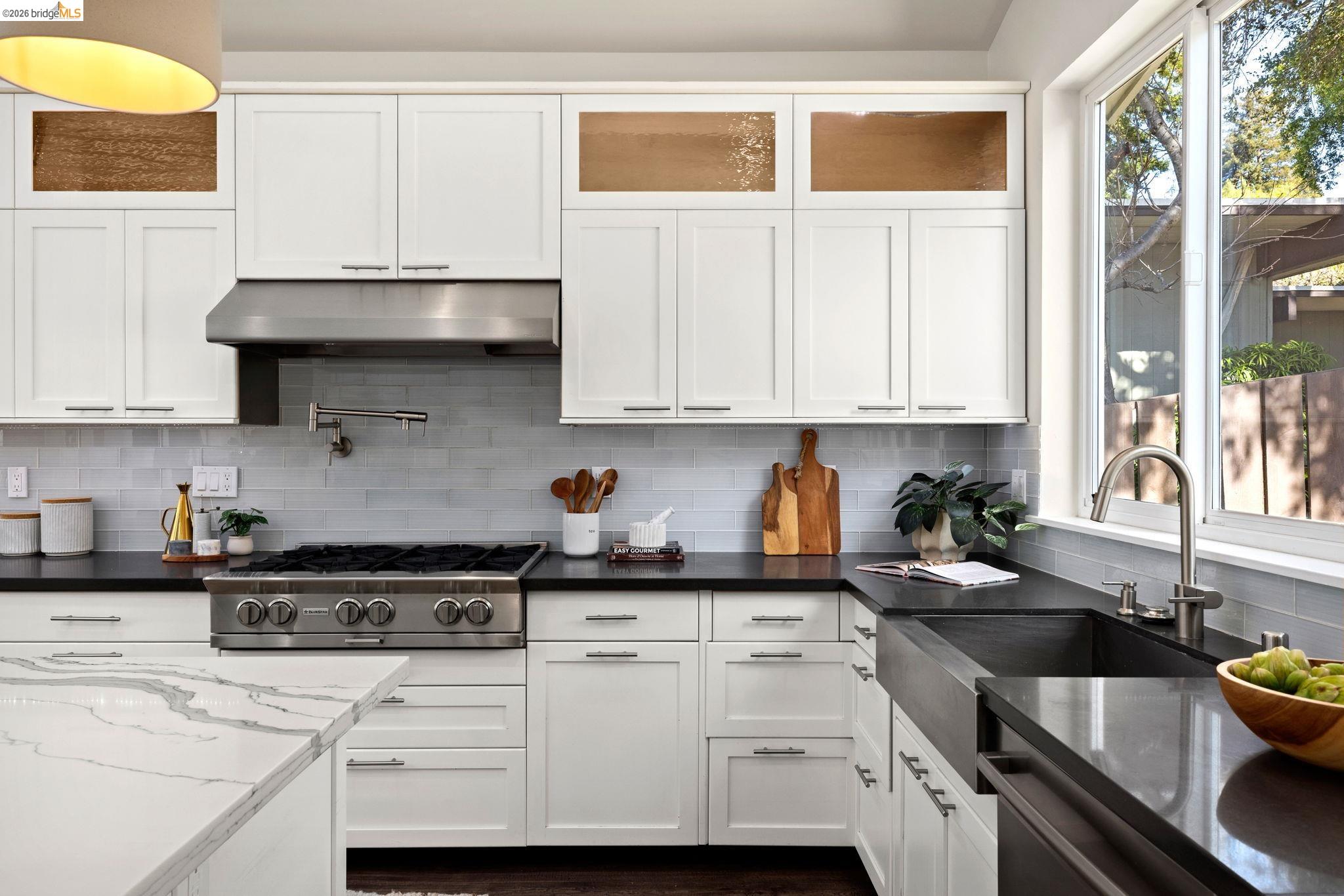 1471 Scenic Avenue Berkeley, CA 94708 - Photo 15 of 42 a kitchen with stainless steel appliances granite countertop a sink a stove and a white cabinets