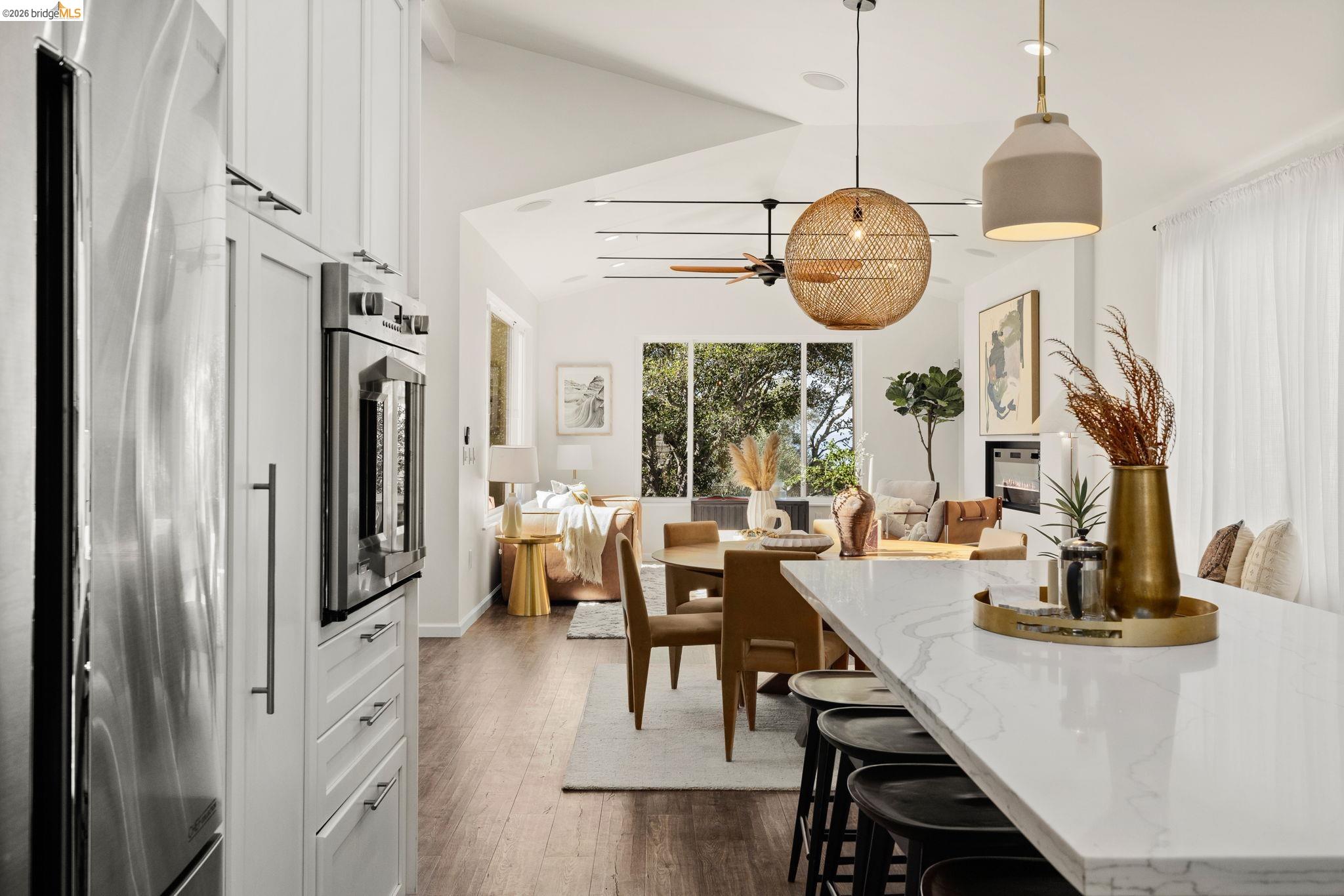 1471 Scenic Avenue Berkeley, CA 94708 - Photo 16 of 42 a view of a dining room with furniture a chandelier and large window