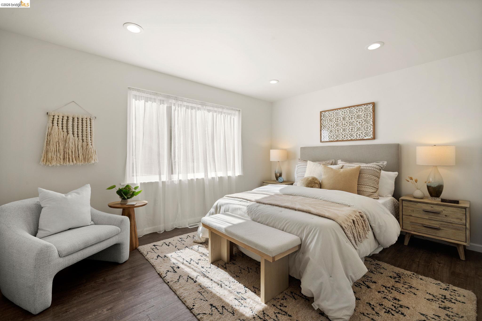 1471 Scenic Avenue Berkeley, CA 94708 - Photo 18 of 42 a bedroom with a bed and wooden floor