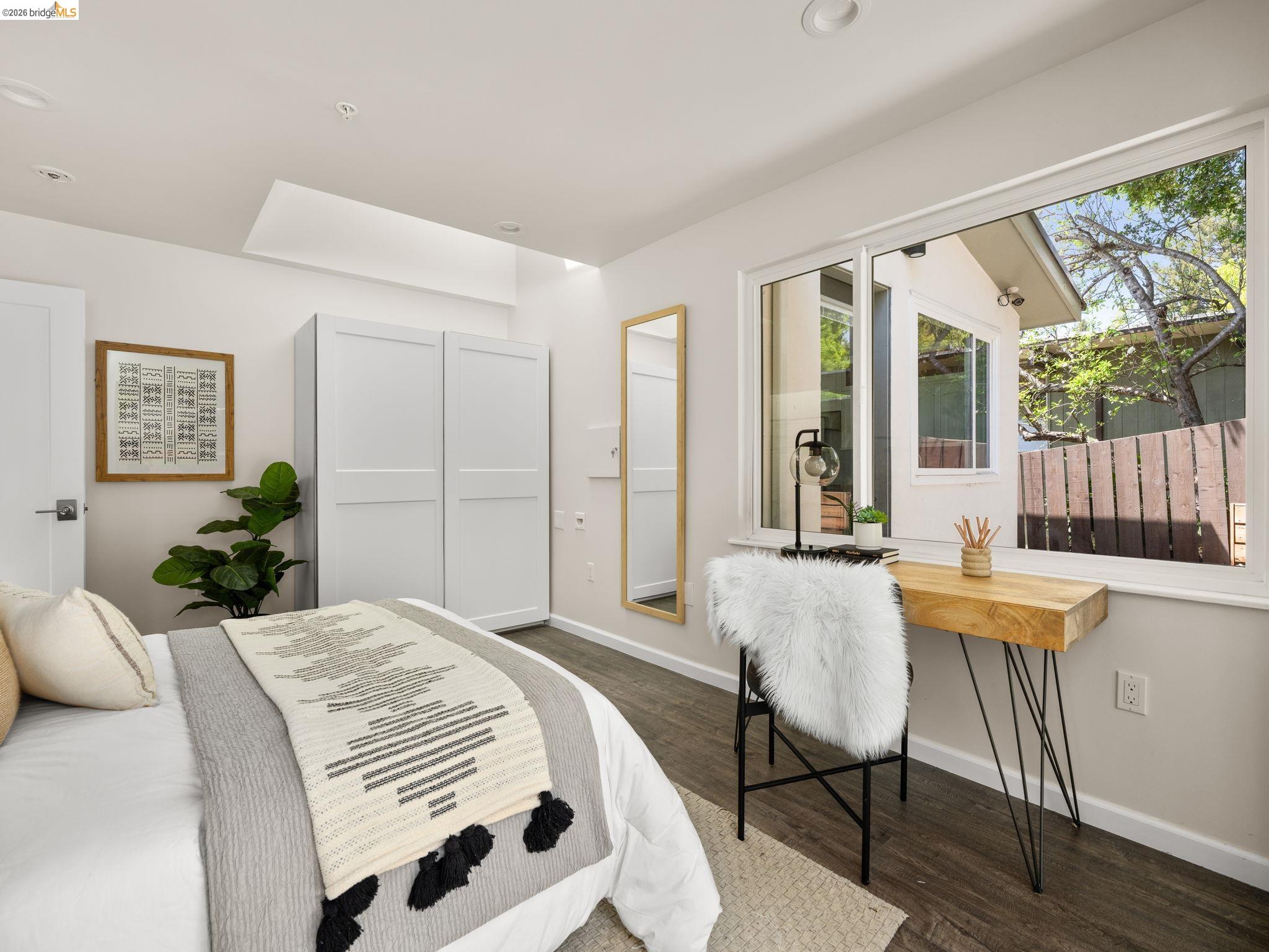 1471 Scenic Avenue Berkeley, CA 94708 - Photo 21 of 42 a spacious bedroom with a bed and a table