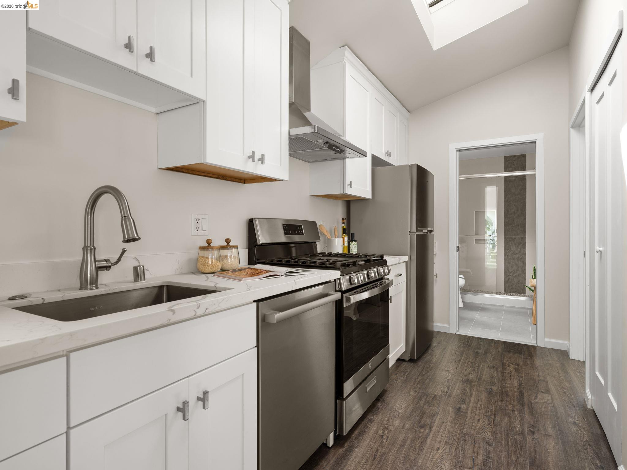 1471 Scenic Avenue Berkeley, CA 94708 - Photo 32 of 42 a kitchen with stainless steel appliances granite countertop a sink stove and refrigerator